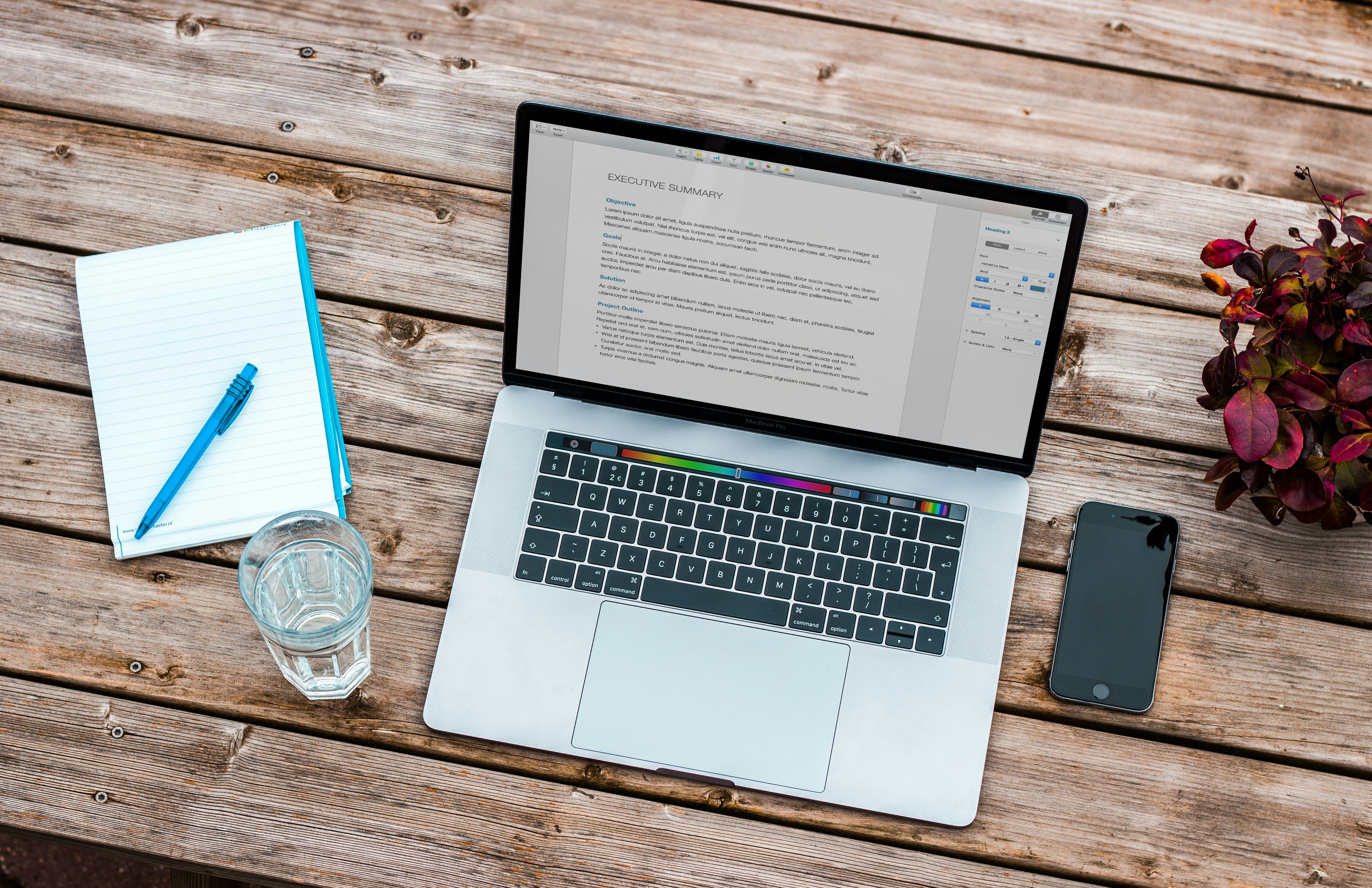 opened laptop on a table - Embed Medium Blog On Website