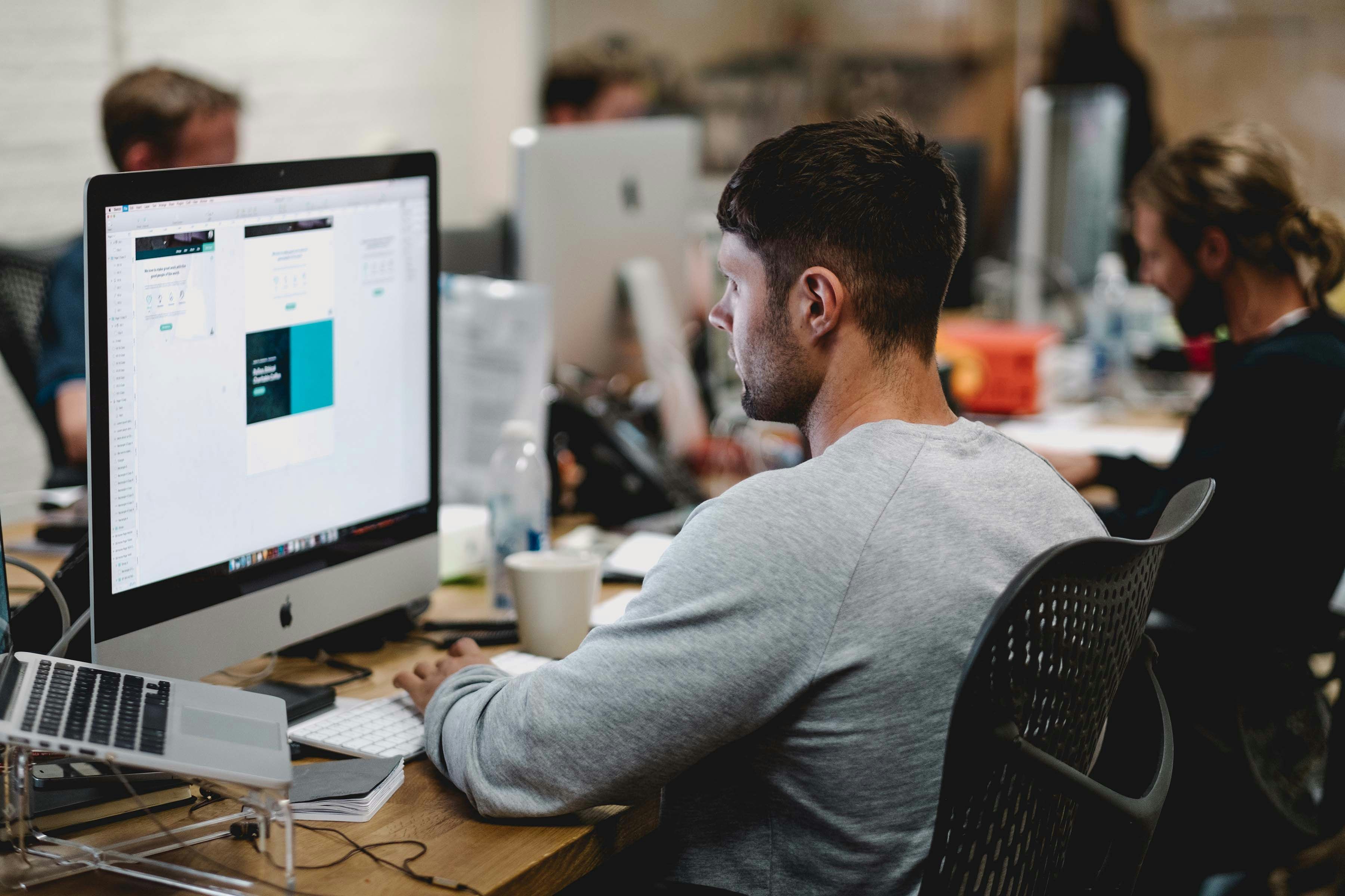 boy working on computer to find Best CMS