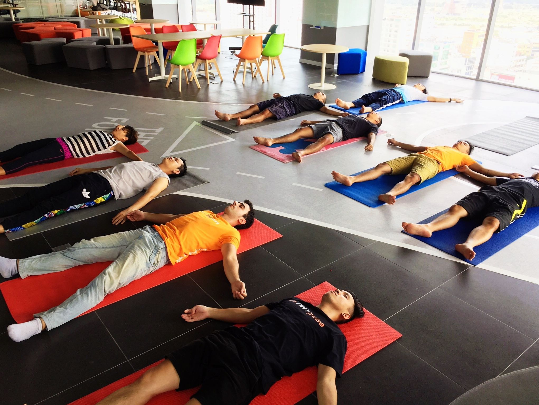 Our team was having a yoga session. Can you spot me? 🤪