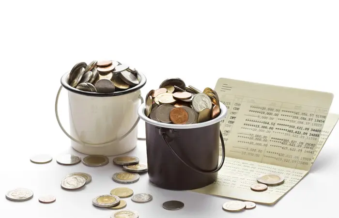 Two buckets filled with coins.