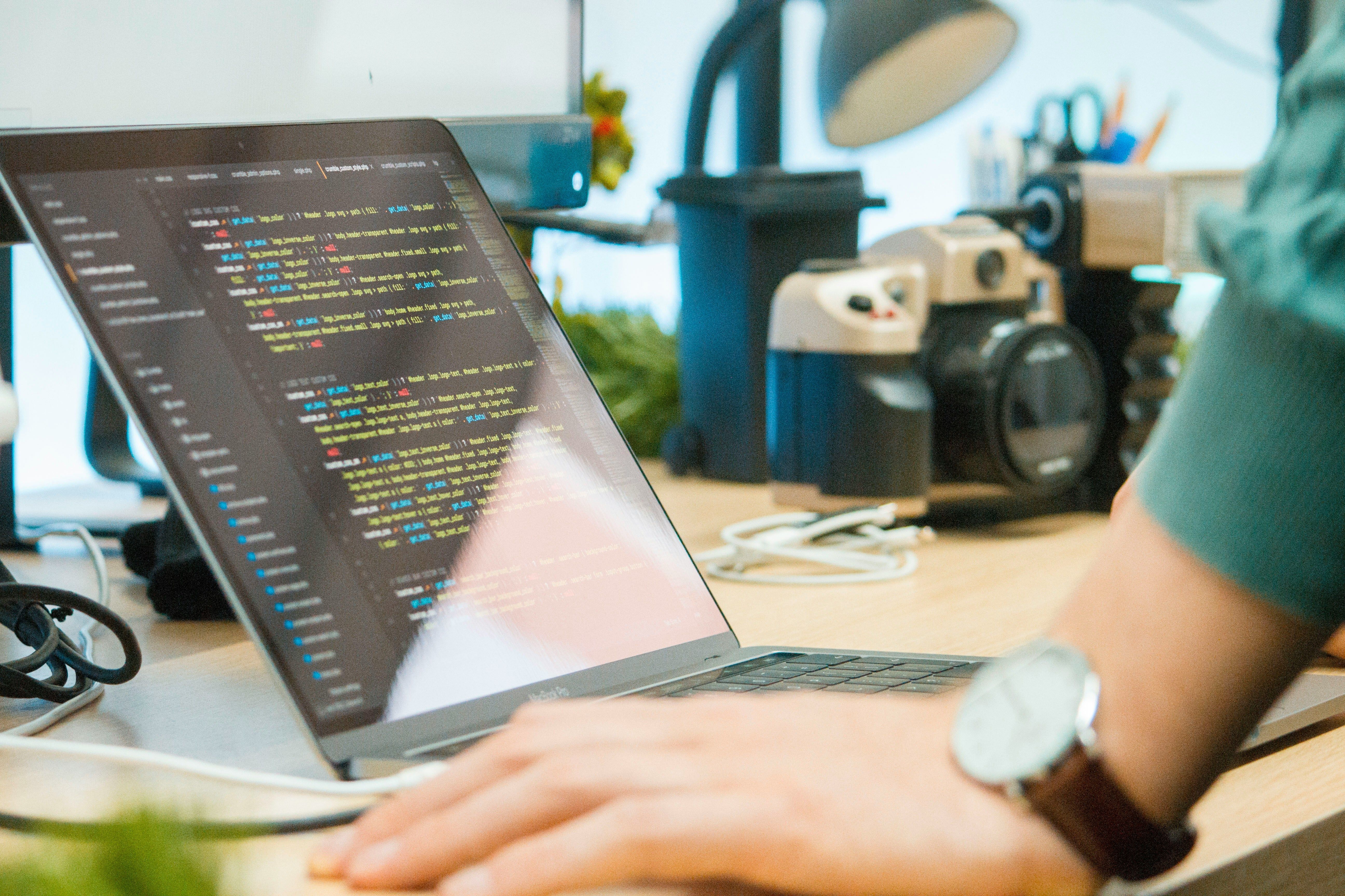 person coding on laptop - RAG Systems