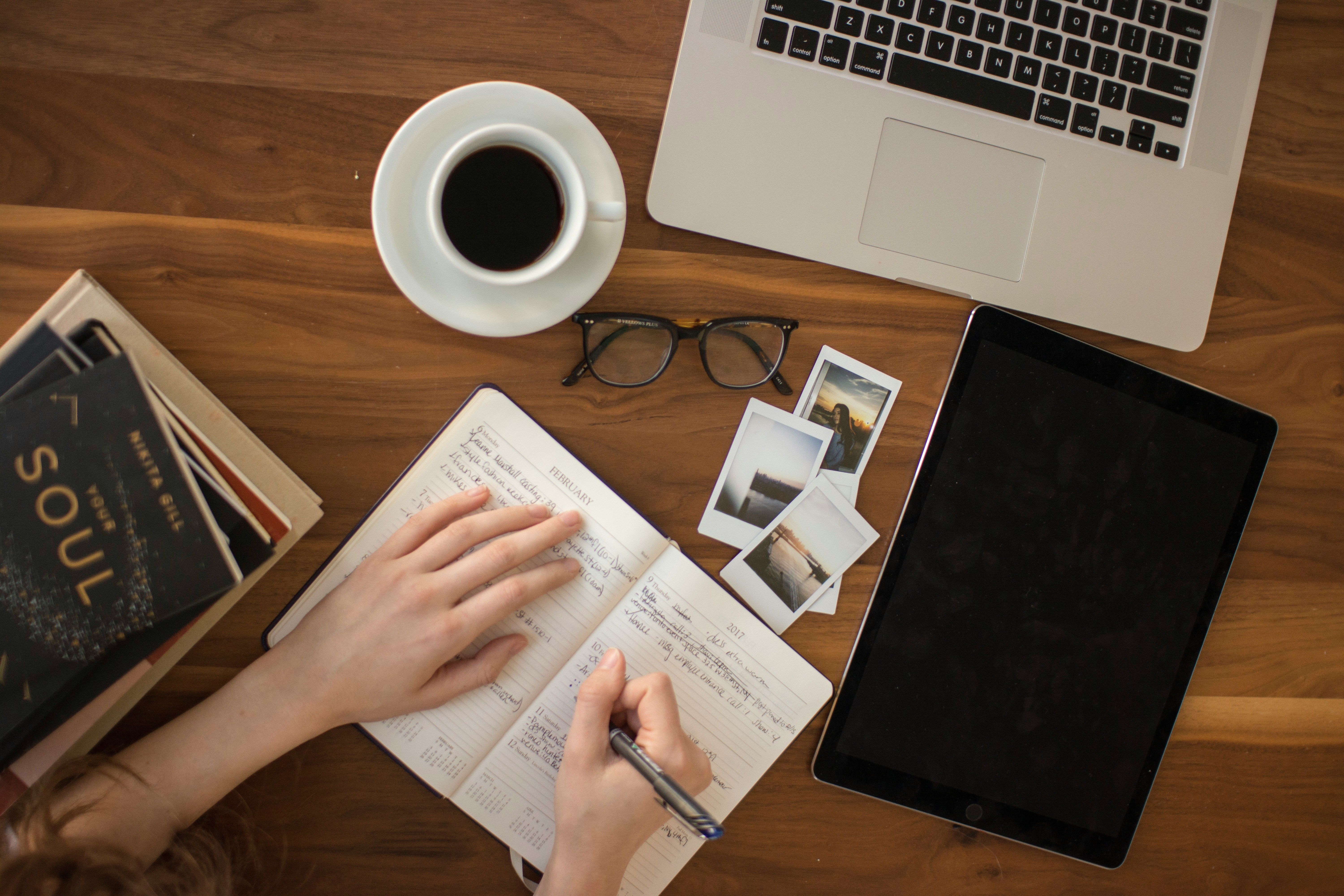 girl writing on a notebook - Embed Medium Blog On Website