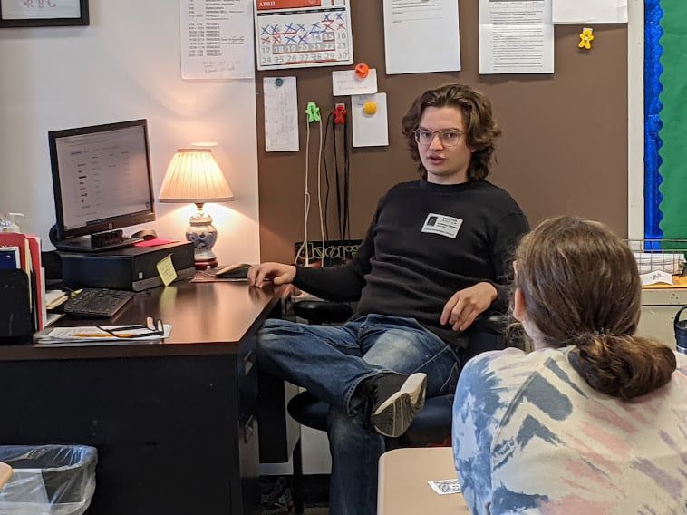 Me, sitting down because it’s the fourth class and my back hurts.