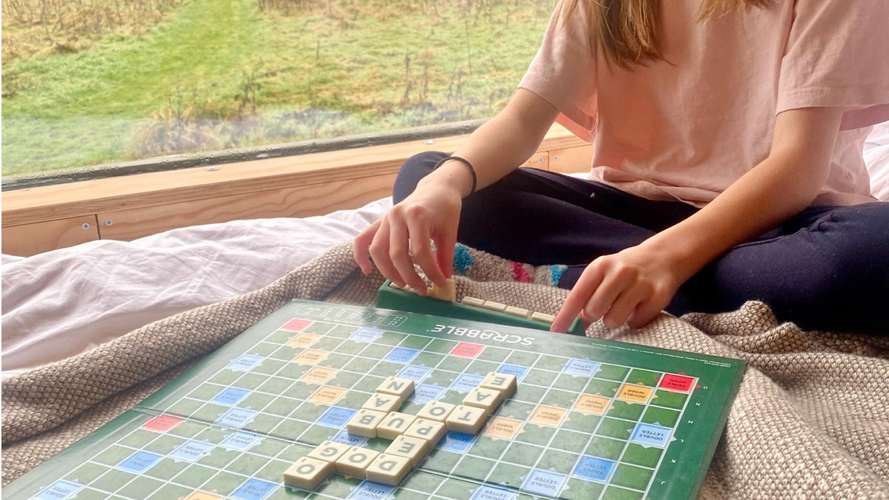 Playing scrabble at Unplugged cabin