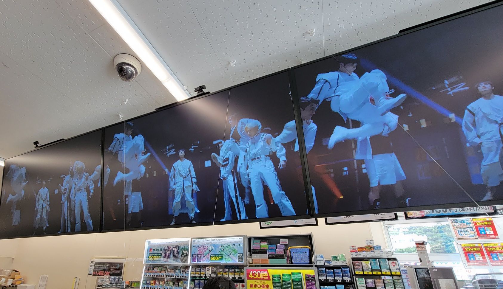 Cameras attached to digital signage in the local Family Marts.